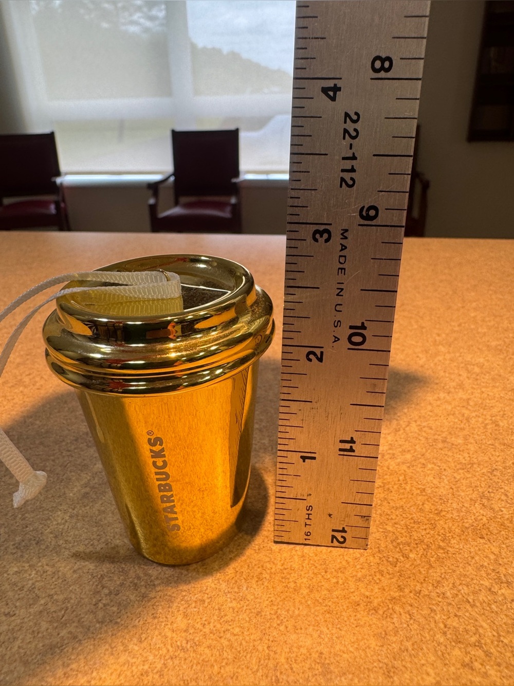 Gold Starbucks holiday ornament